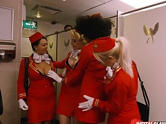 Gorgeous stewardess attacked by a randy cohort in a toilet